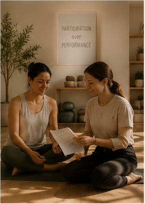 Two people talking warmly at mat level after a Recovery Movement session.